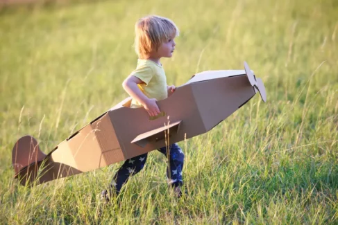 A small boy with a toy aeroplane