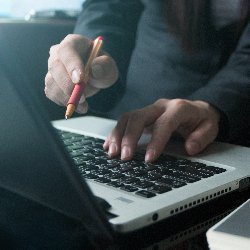 Man Using Hotel Management Software