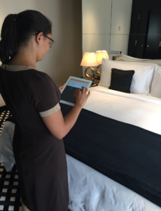 housekeeping-team-member-using-hotsos-ipad