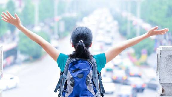 back view of Girls with his bagpack