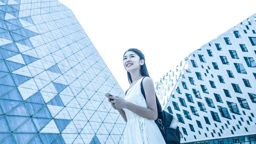 Girl walking with her mobile phone