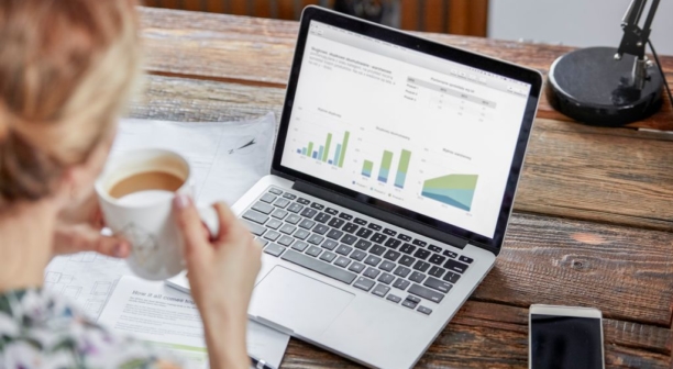 Businesswoman-drinking-tea-and-reviewing-data-at-laptop_612x336_acf_cropped-1