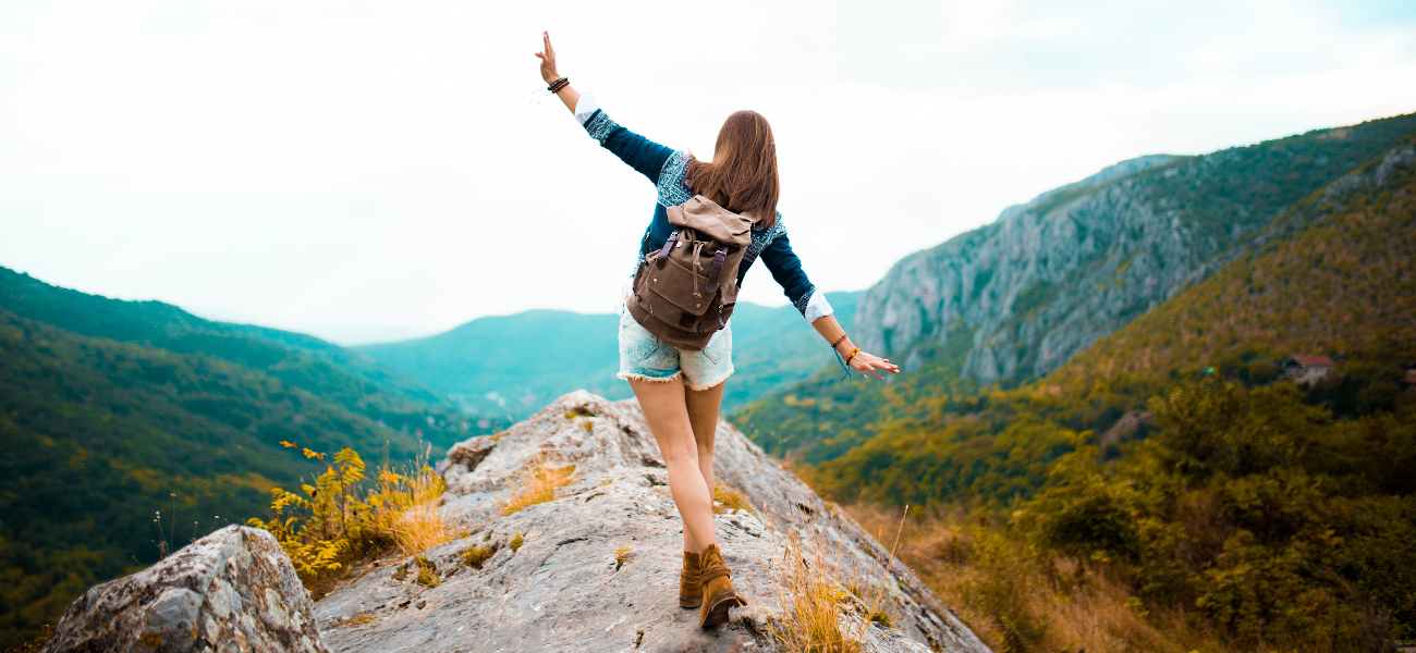 Hippie woman stroll on mountain