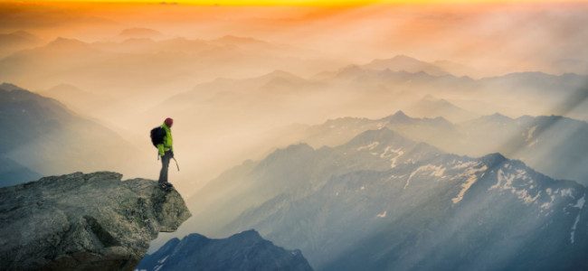 A man standing in the mountain