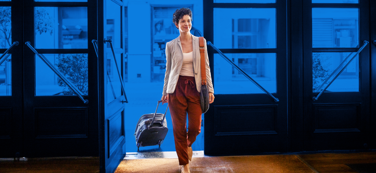 Female business traveler arriving at hotel