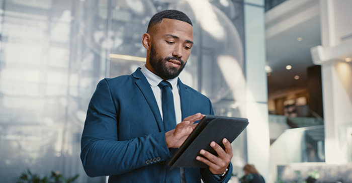 business man looking at tablet image